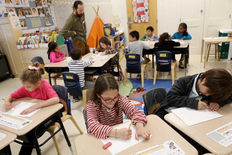 A student group at desks in their classroom